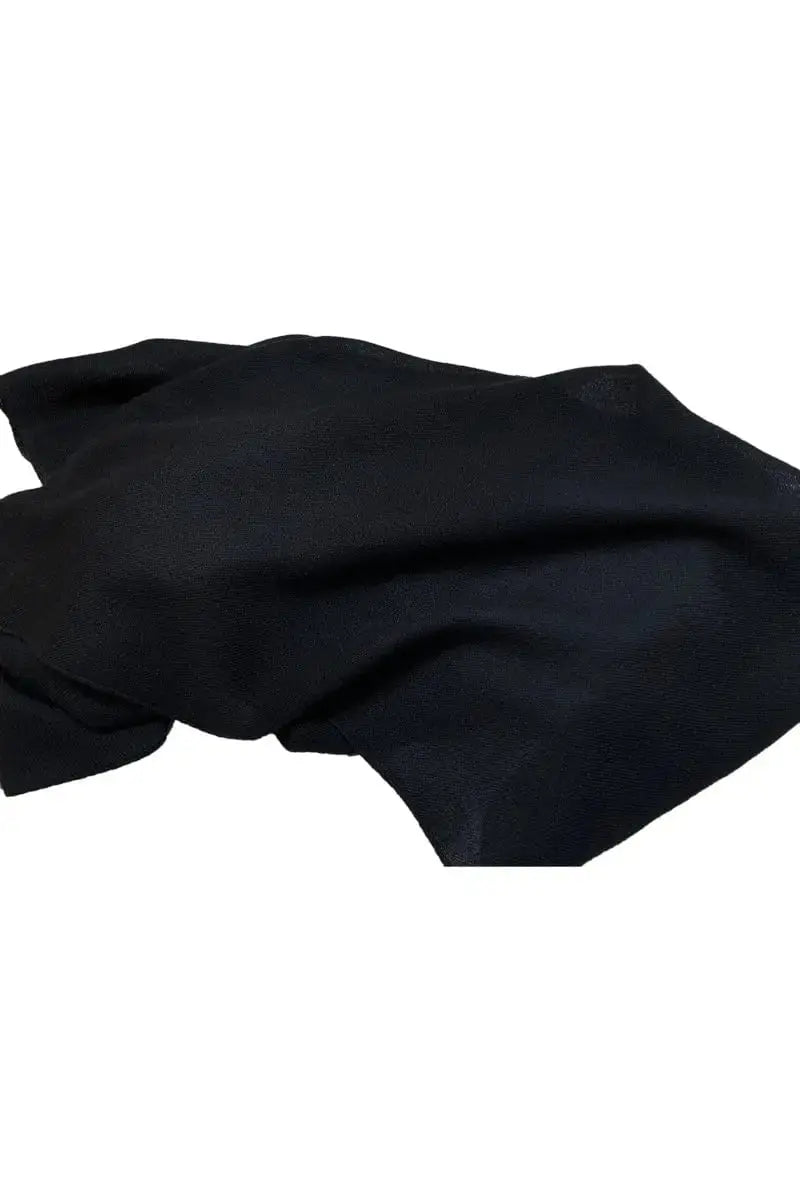 Display of a black Pia Woven Shawl Qiviuk by Qiviuk Boutique