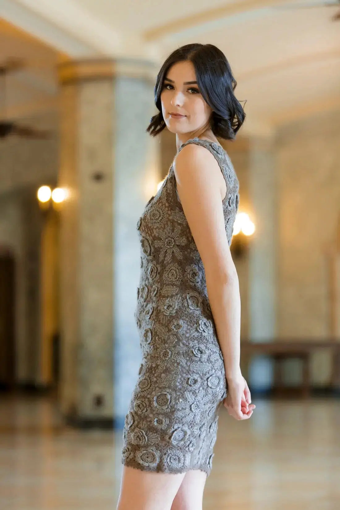 A side view of a Qiviuk & Silk Nelida woman dress by Qiviuk Boutique