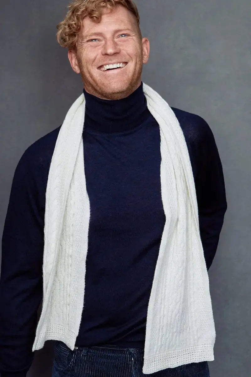 man wearing a White Fisherman Unisex Scarf around his neck made of Merino Wool by Qori