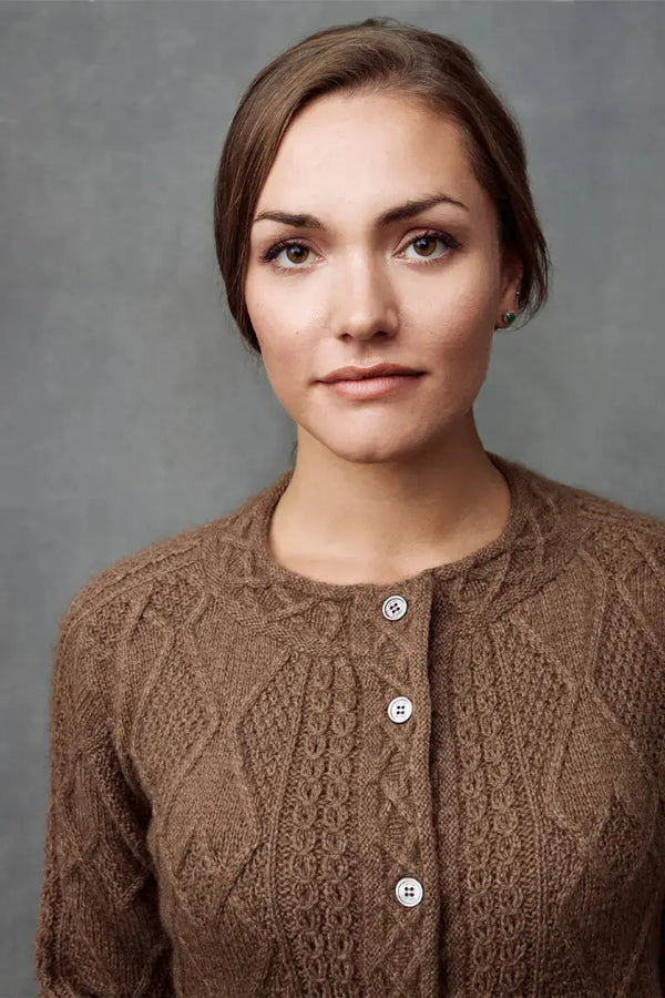 a front view of a brown Qiviuk Mena woman cardigan sweater by Qiviuk Boutique