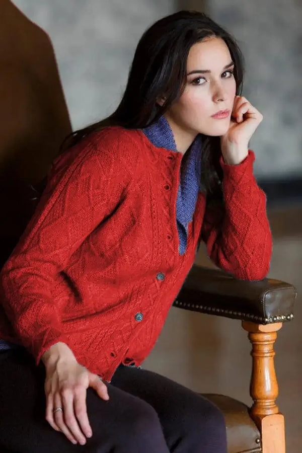 A side view Mena Woman Cardigan Qiviuk & Merino in red by Qiviuk Boutique
