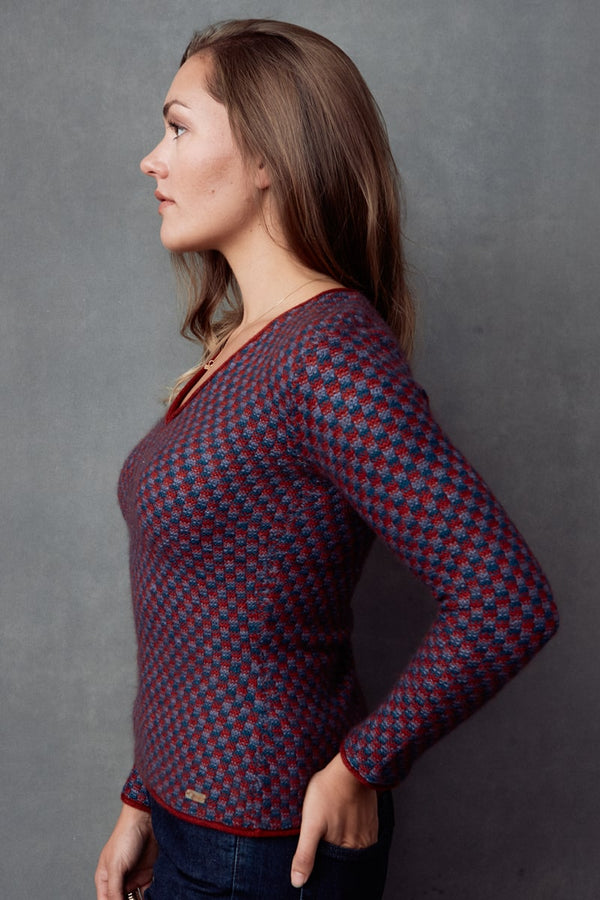 A side view of the Melody Woman Pullover sweater made with Qiviuk, Merino & Silk by Qiviuk Boutique