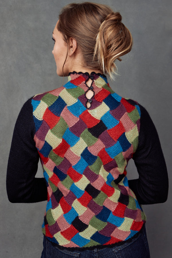 A back view of a Mirella Woman Pullover sweater made of Qiviuk, Merino & Silk by Qiviuk Boutique