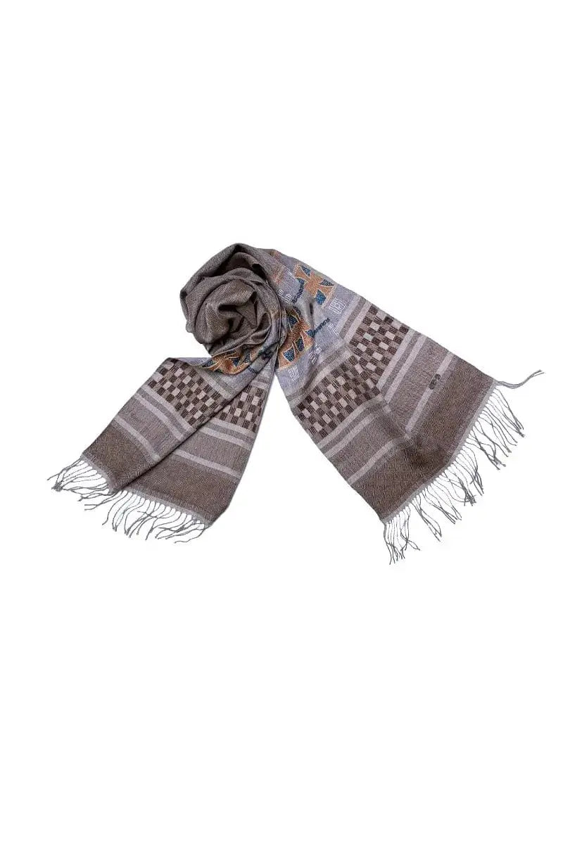 Monserrat This stylish scarf features a unique design in a mix of vibrant colors that will liven up your outfit.  This scarf is made with a luxurious Qiviuk and Mulberry Silk yarn,  Qiviuk & Silk by Qiviuk Boutique