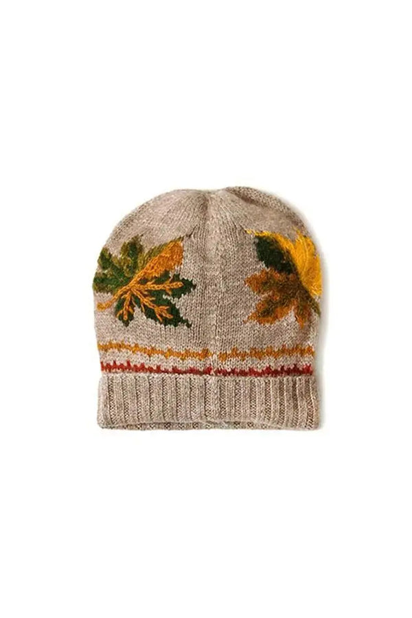 hta with fall leaves made with Qiviuk, Merino & Silk Wind hat in natural by Qiviuk Boutique