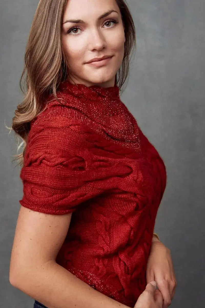 A side view of a red Chani Woman Pullover sweater made of Qiviuk, Merino & Silk in petite by Qiviuk Boutique